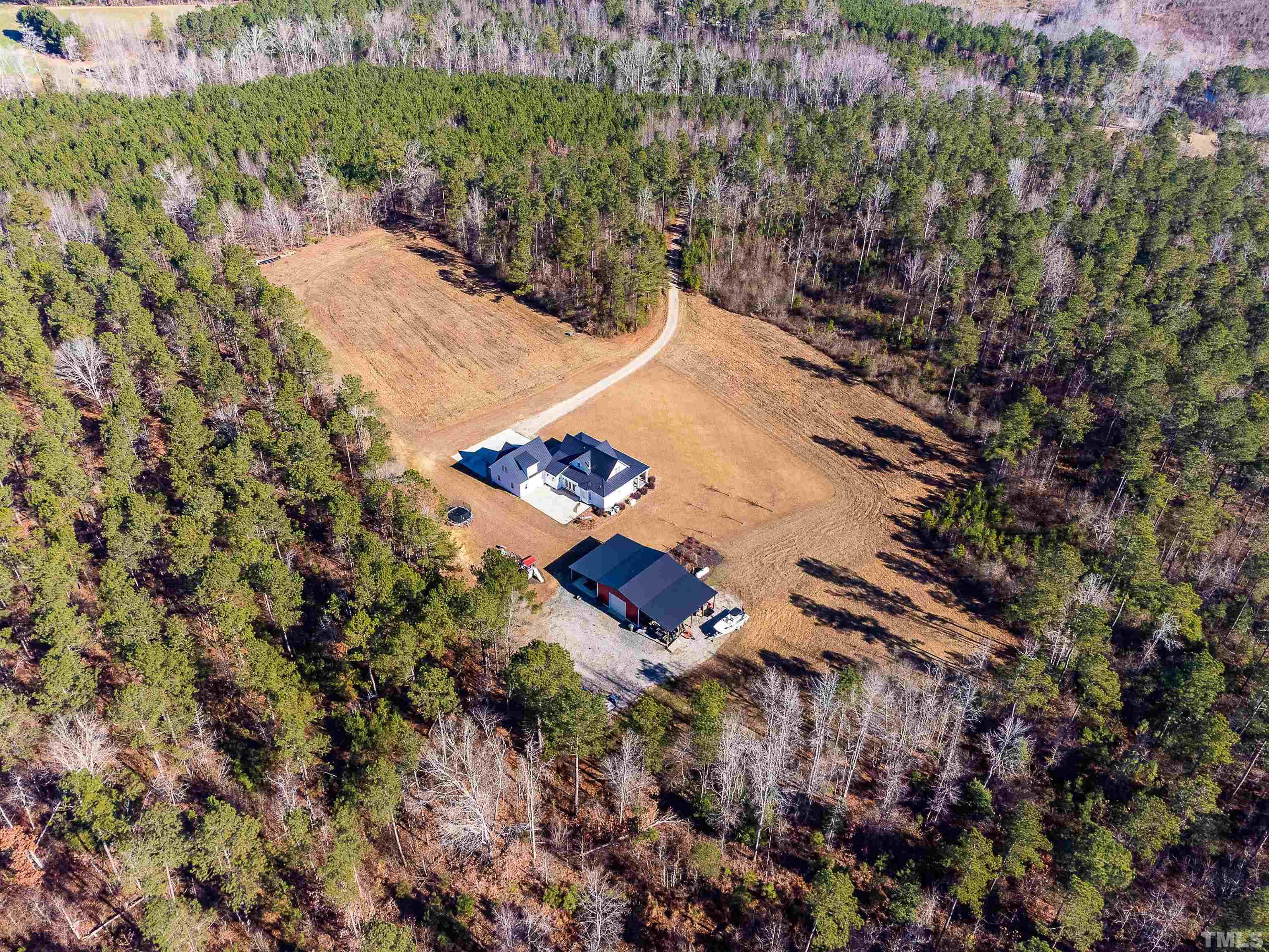 4300 Debnam Road Zebulon, NC 27597 - Photo 14 of 54 an aerial view of a house with a yard