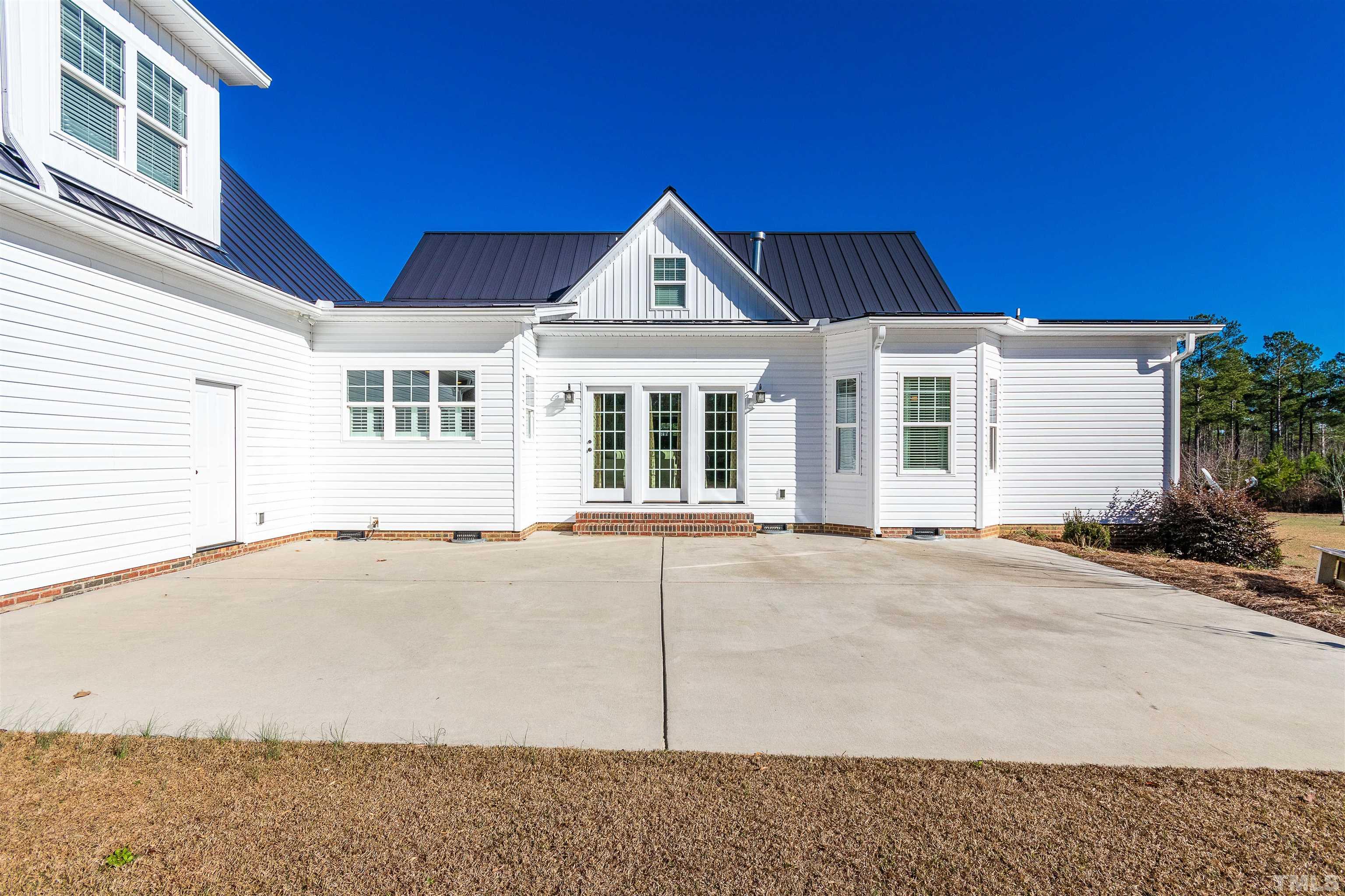 4300 Debnam Road Zebulon, NC 27597 - Photo 21 of 54 a view of a house with a yard and garage