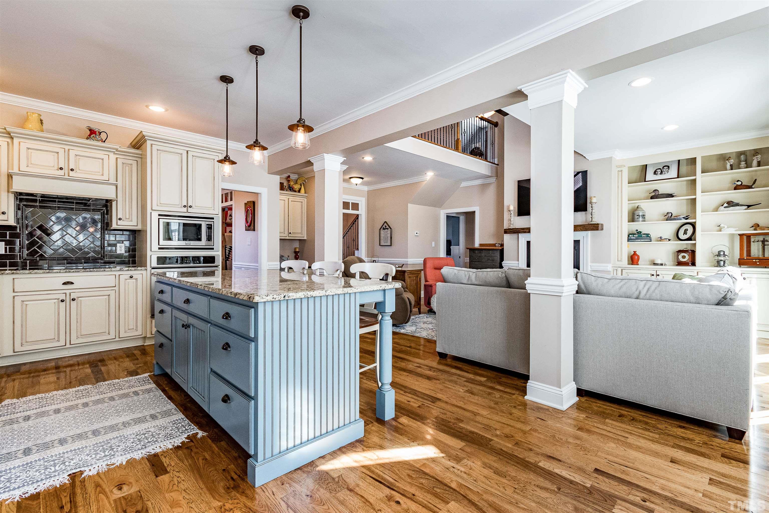 4300 Debnam Road Zebulon, NC 27597 - Photo 24 of 54 a kitchen with stainless steel appliances kitchen island granite countertop a stove and a sink