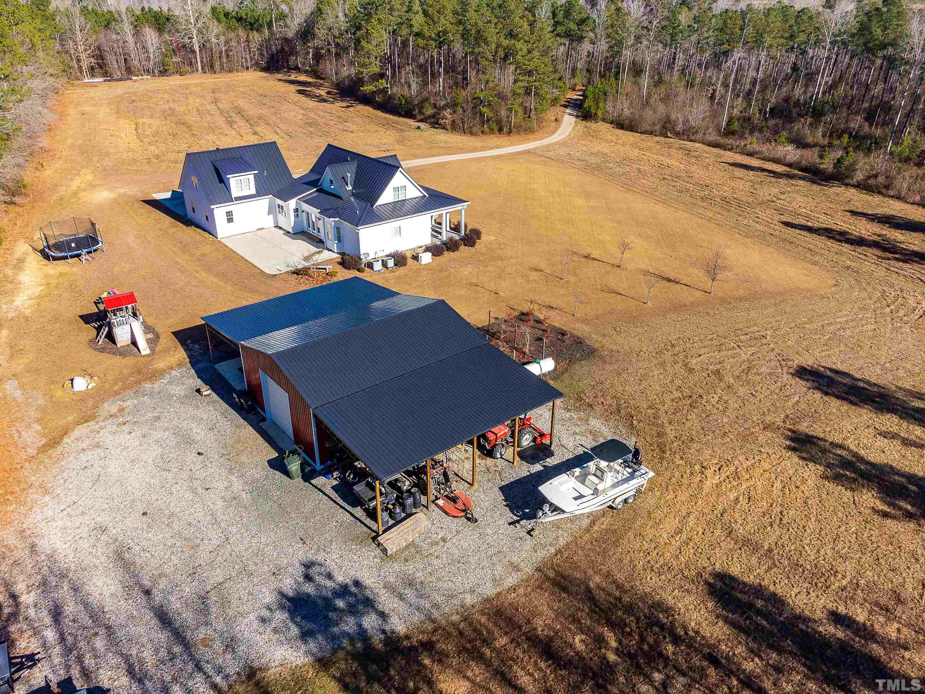 4300 Debnam Road Zebulon, NC 27597 - Photo 4 of 54 an aerial view of a house with a yard