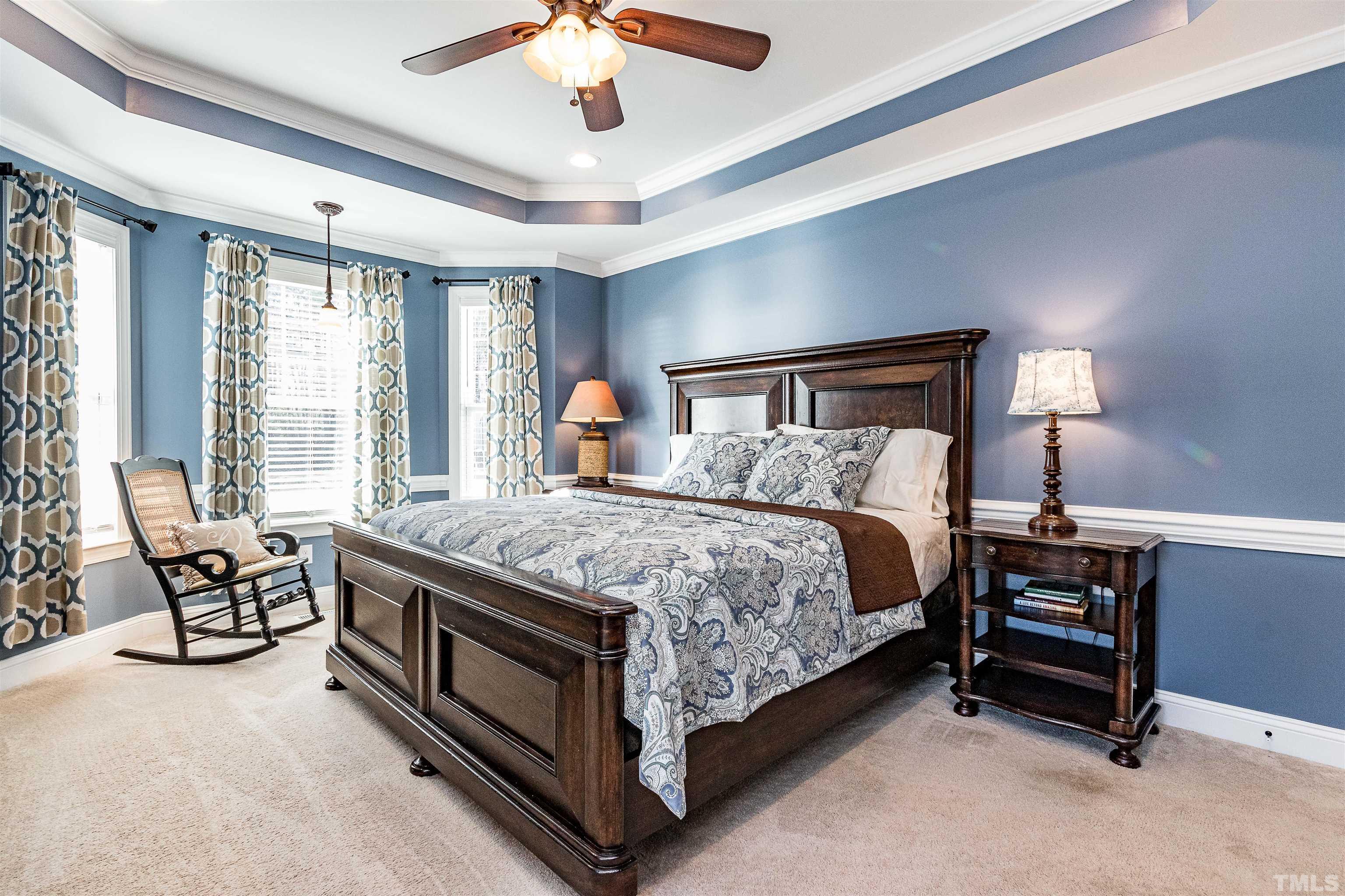 4300 Debnam Road Zebulon, NC 27597 - Photo 41 of 54 a bed sitting in a spacious bedroom next to a window