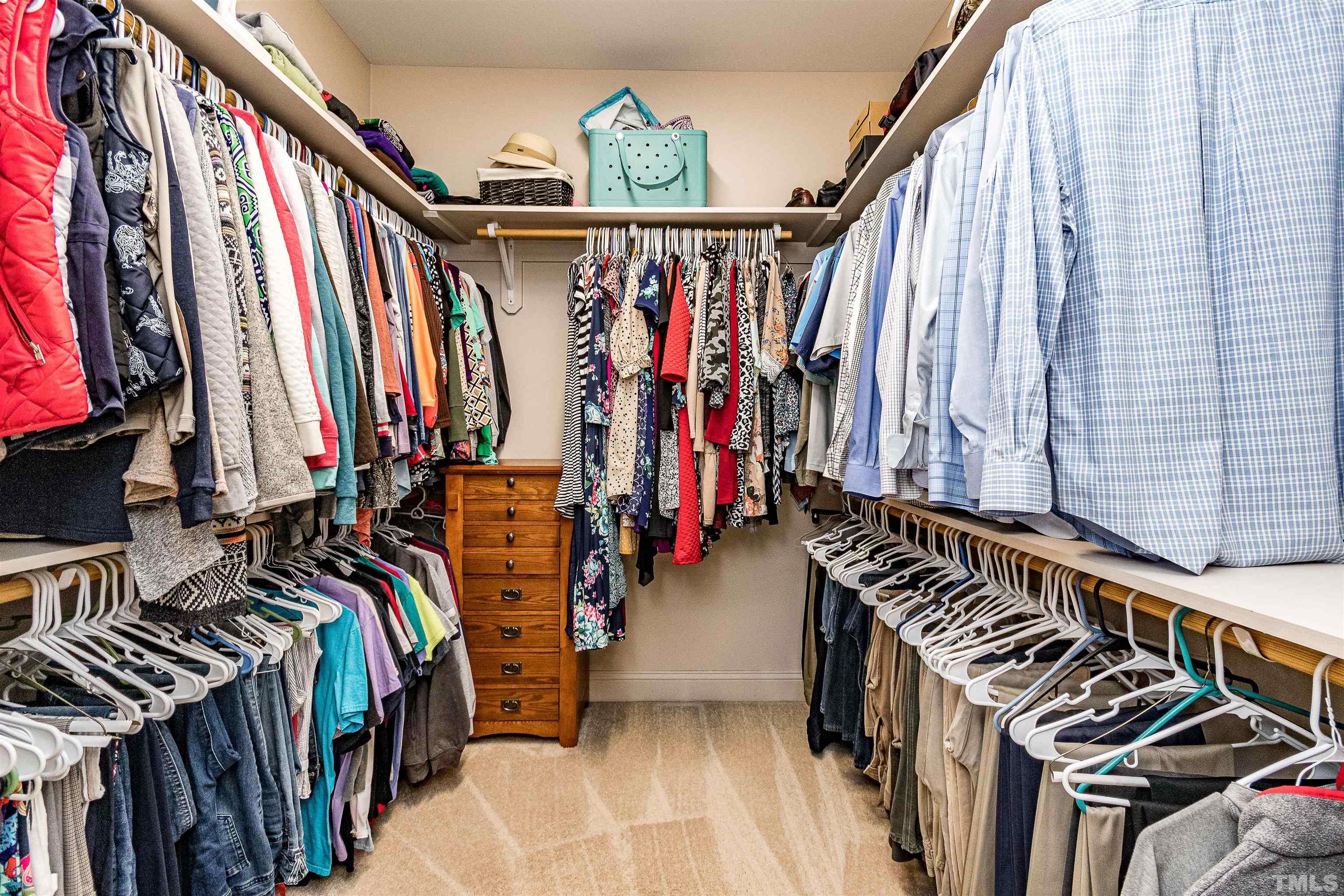 4300 Debnam Road Zebulon, NC 27597 - Photo 42 of 54 a view of walk in closet with clothes