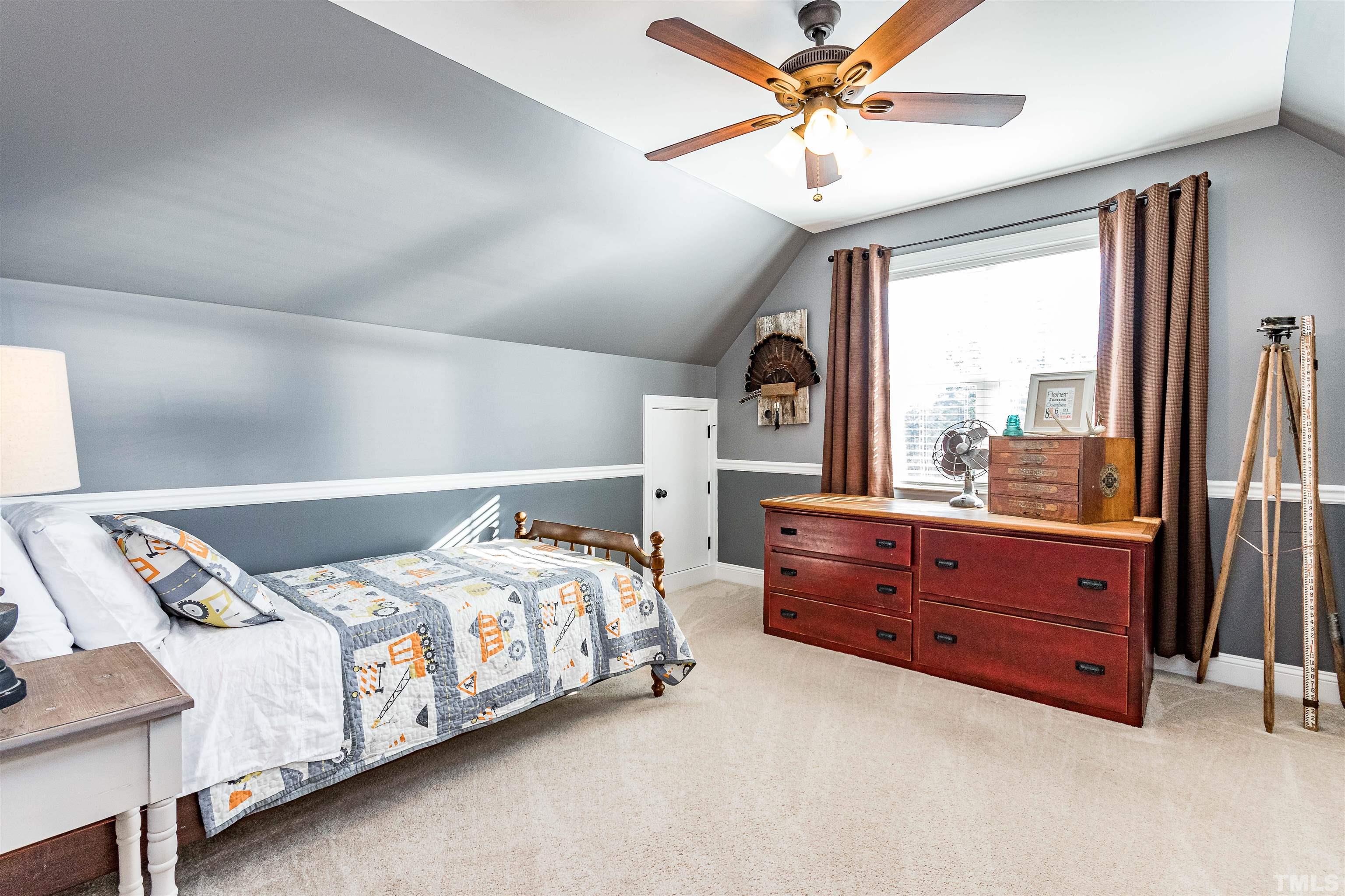 4300 Debnam Road Zebulon, NC 27597 - Photo 46 of 54 a bedroom with a bed dresser and a window