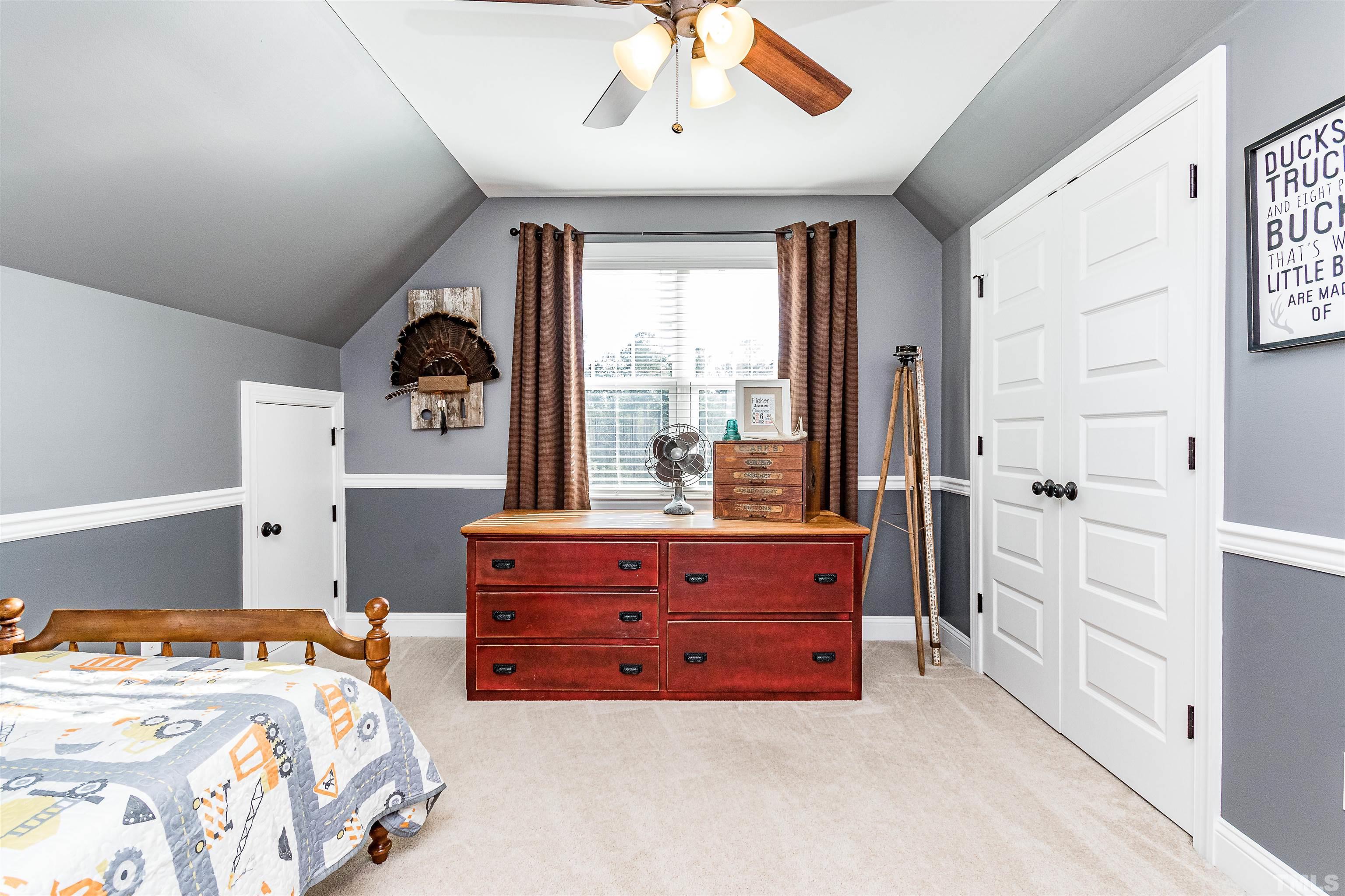 4300 Debnam Road Zebulon, NC 27597 - Photo 47 of 54 a bedroom with a bed and a window