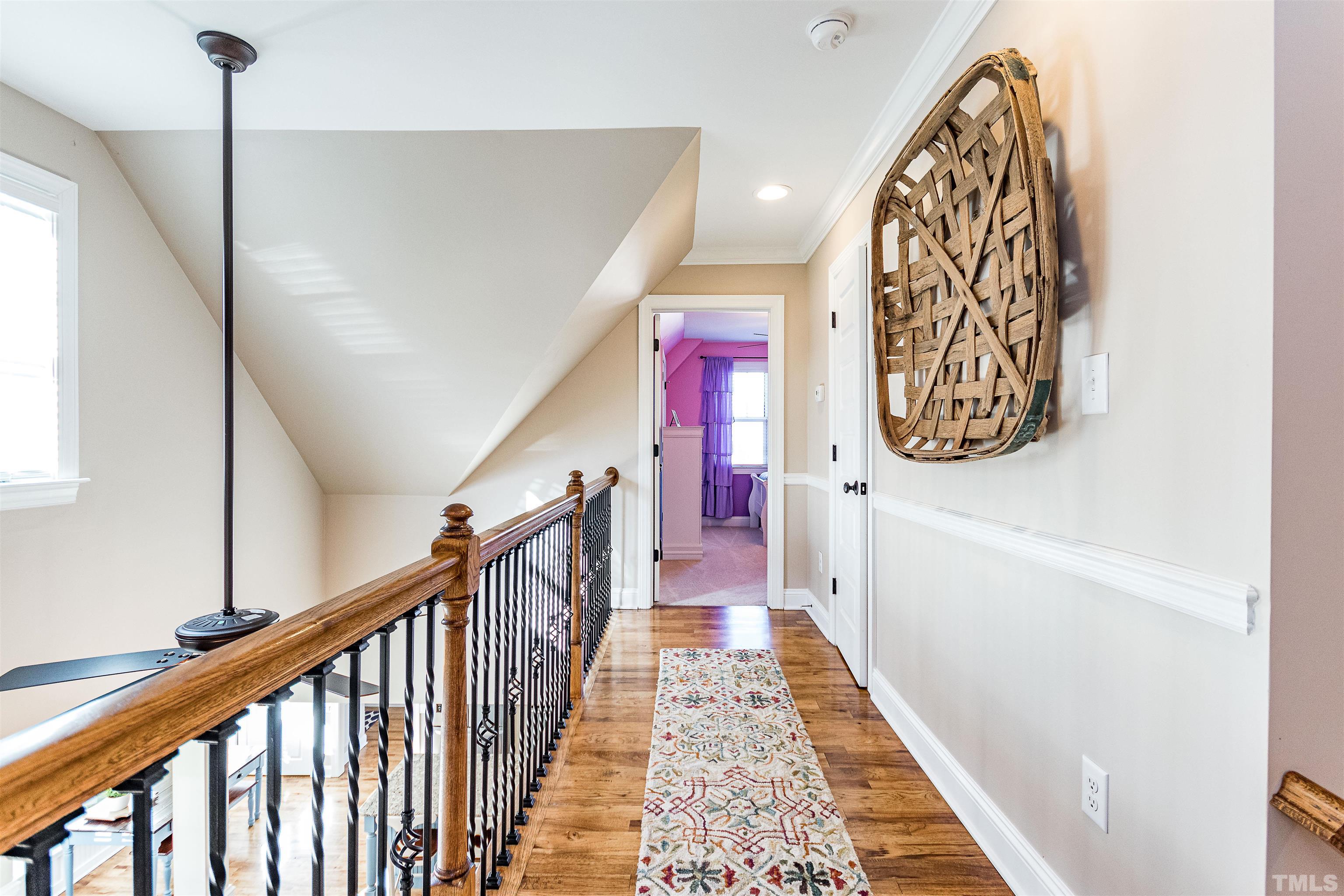 4300 Debnam Road Zebulon, NC 27597 - Photo 51 of 54 a view of a hallway with wooden floor and stairs