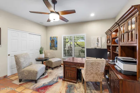 a room with furniture and book shelf