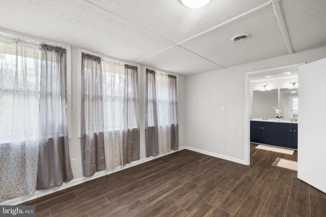 a view of entryway with wooden floor