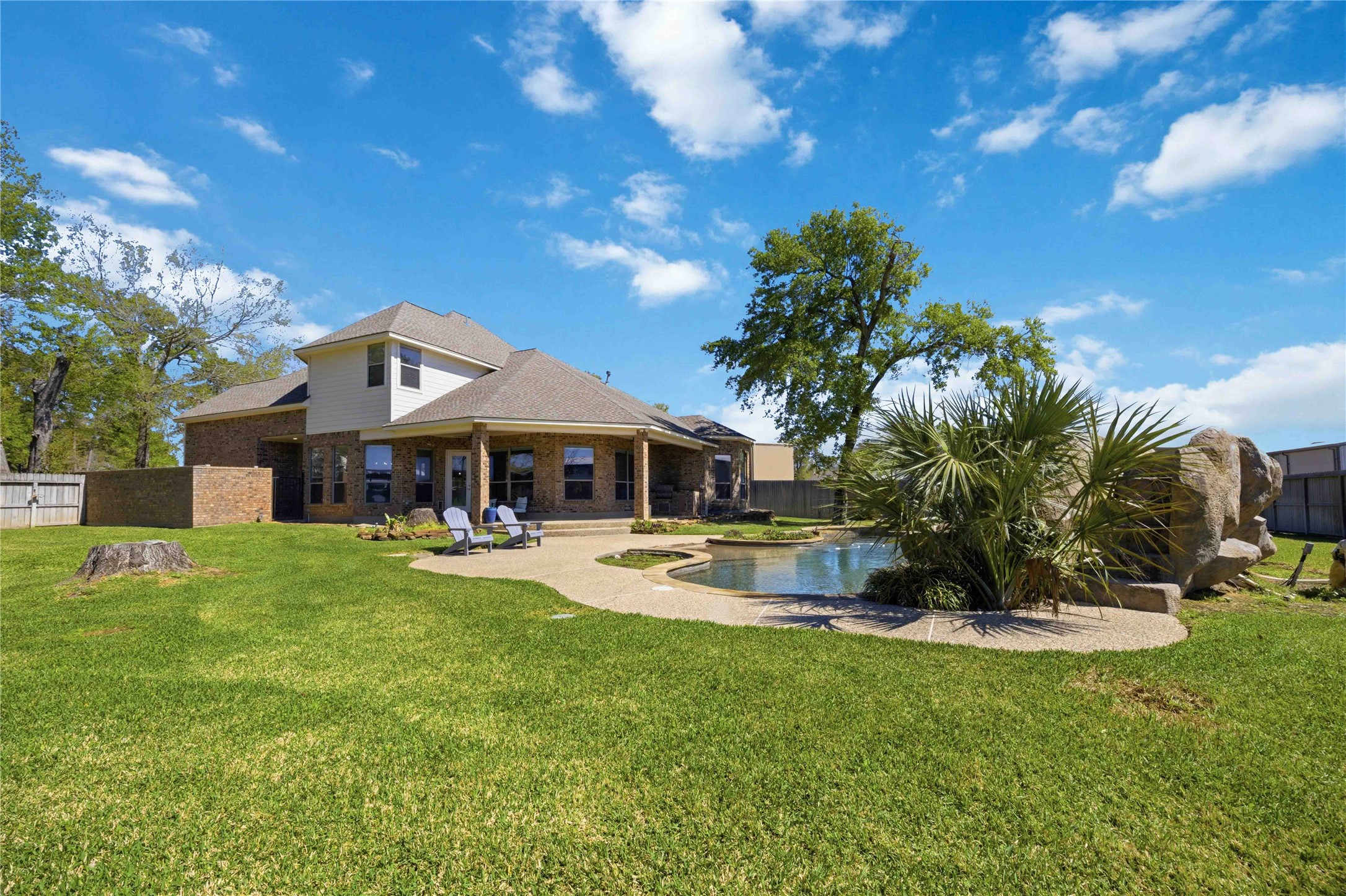 1930 Old River Road Montgomery, TX 77356 - Photo 31 of 49 Outdoor living at its finest! Enjoy the sprawling backyard with a central pool surrounded by plenty of sod all around.