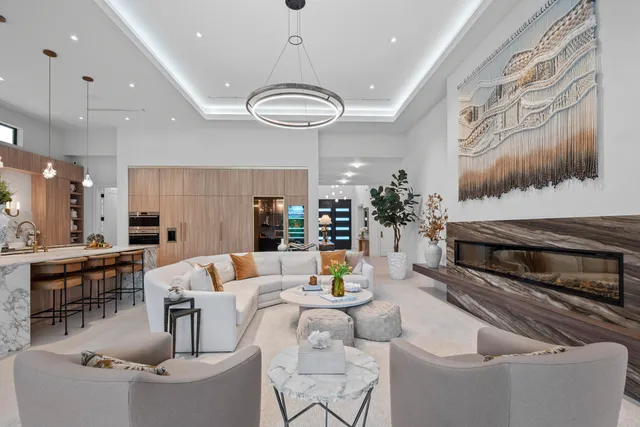 a bathroom with double vanity sinks a large mirror and a shower