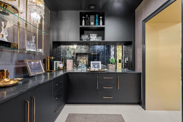 a living room with furniture and a bookshelf