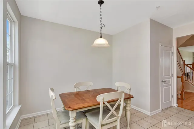 a view of a room with furniture and wooden floor