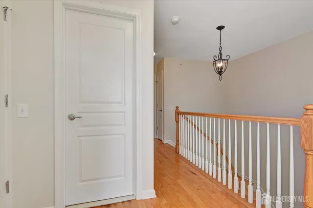 a view of a hallway with a chandelier