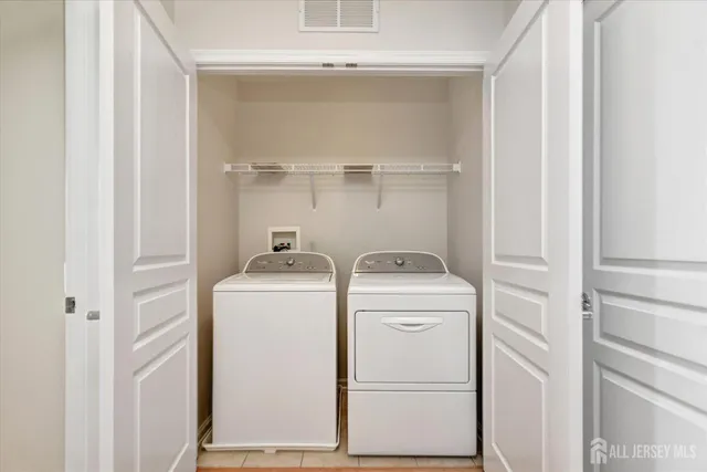 a utility room with dryer and washer