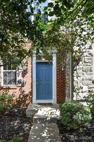 a house with a tree in front of it