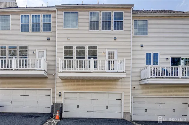 a front view of a building with a lot of windows