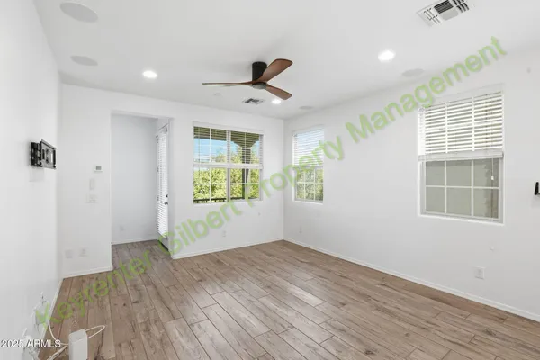 a view of an entryway with wooden floor