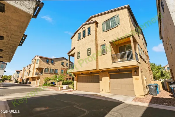 an empty room with windows and entrance