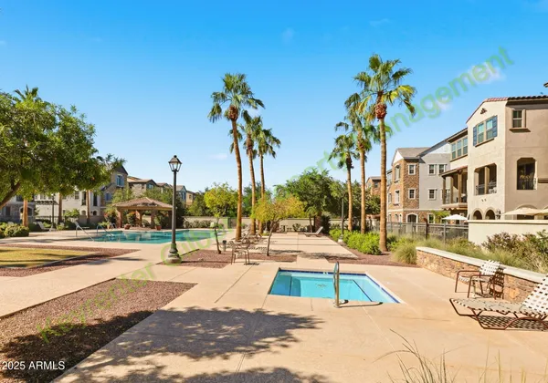 a view of a lake with houses in all around