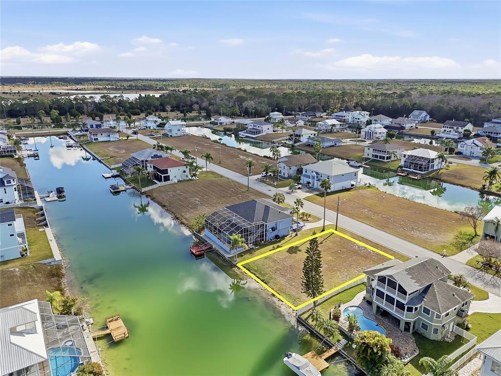 Undisclosed Address Hernando Beach, FL 34607 - Photo 3 of 14 an aerial view of residential houses with outdoor space