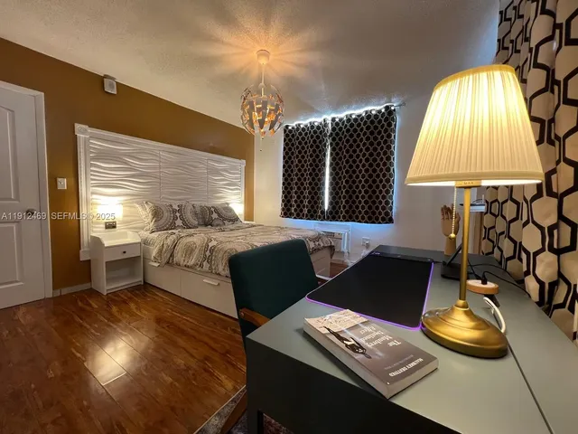 a bed room with a bed and a window