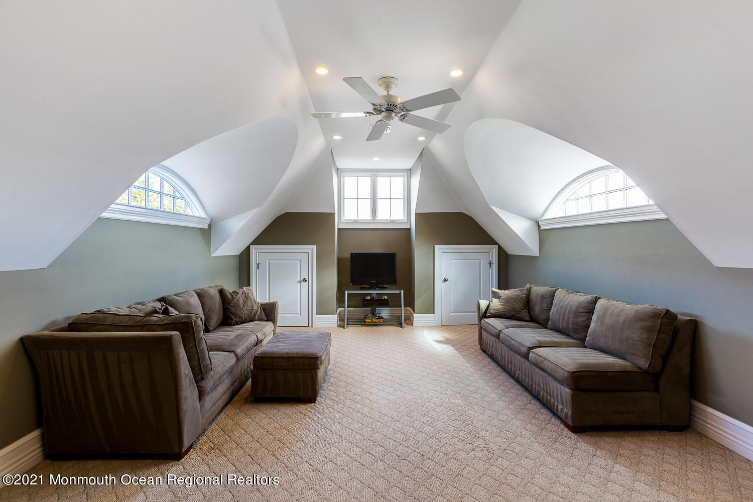 2 Harbor Drive Rumson, NJ 07760 - Photo 28 of 50 a living room with furniture a fireplace and a chandelier