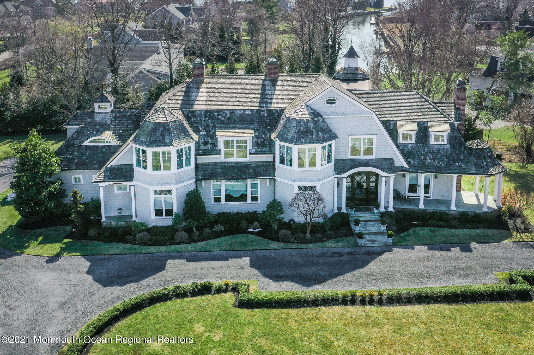 2 Harbor Drive Rumson, NJ 07760 - Photo 50 of 50 a aerial view of a white house next to a yard with big trees