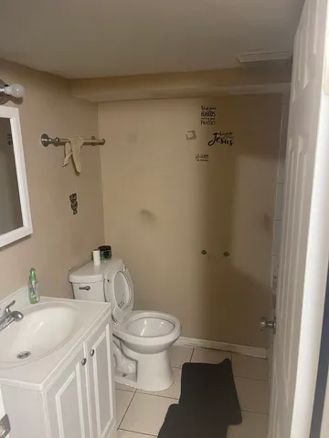 a bedroom with a bed and gym equipment