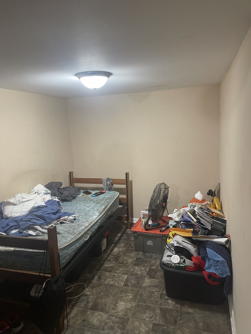 6953 South Artesian Avenue Chicago, IL 60629 - Photo 17 of 23 a bedroom with a bed and gym equipment