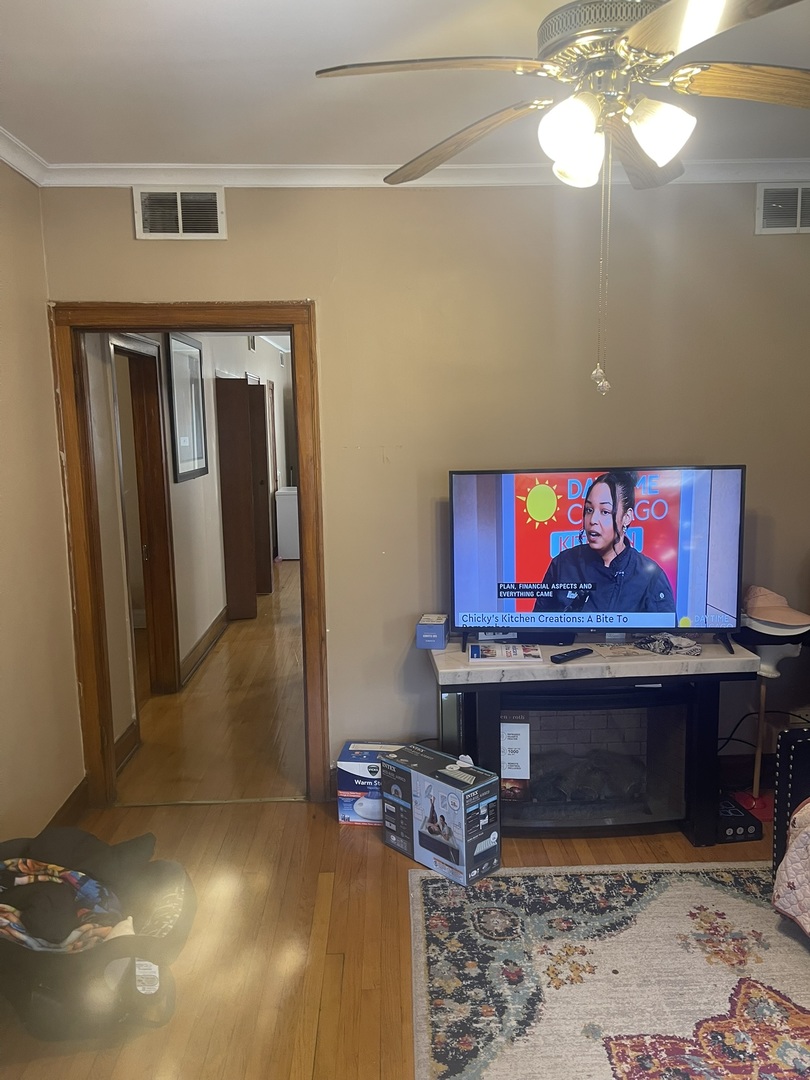 6953 South Artesian Avenue Chicago, IL 60629 - Photo 19 of 23 a room with furniture and a fireplace