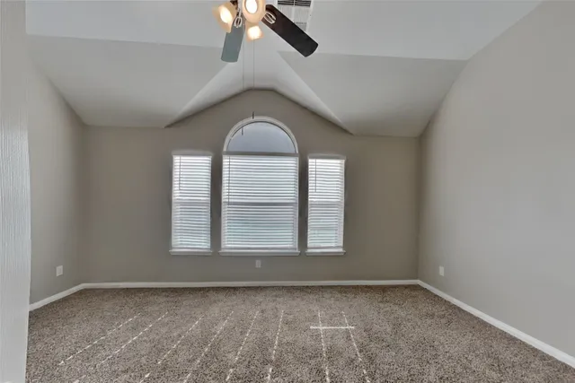 an empty room with a empty space and windows