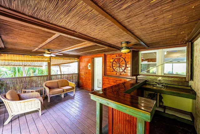 a kitchen with stainless steel appliances granite countertop a sink and wooden floors