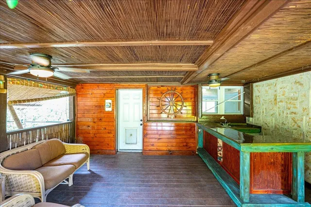 a view of a porch with wooden floor