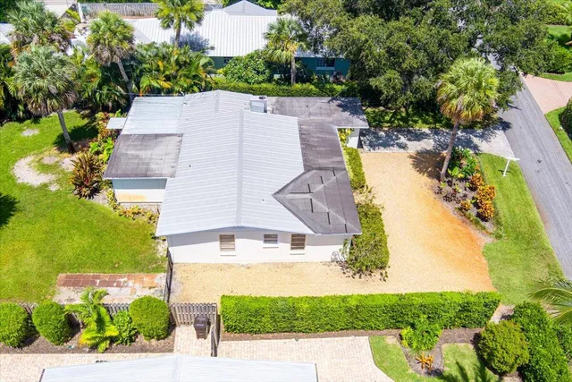 an aerial view of a house with swimming pool