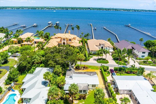 an aerial view of houses with outdoor space