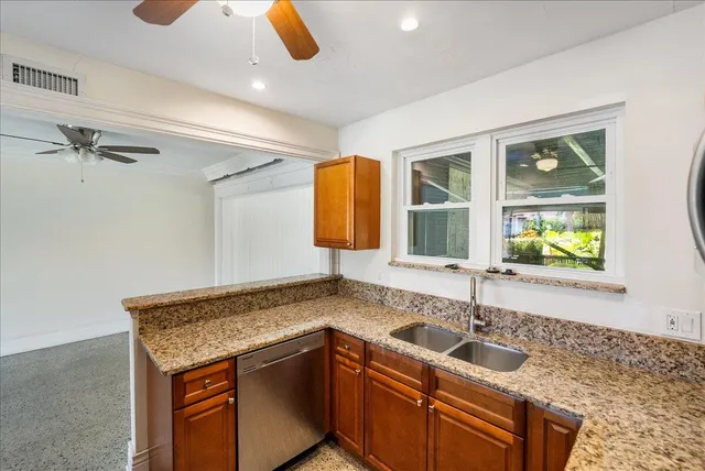 a kitchen with a sink and a window