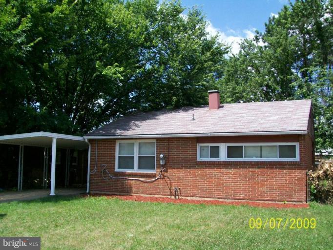 336 Suter Road Catonsville, MD 21228 - Photo 1 of 10 a front view of a house with a yard and green space