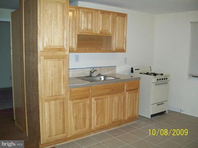 336 Suter Road Catonsville, MD 21228 - Photo 3 of 10 a bathroom with a sink and a cabinet