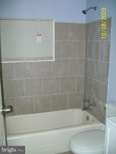 336 Suter Road Catonsville, MD 21228 - Photo 7 of 10 a bathroom with a bathtub and a shower