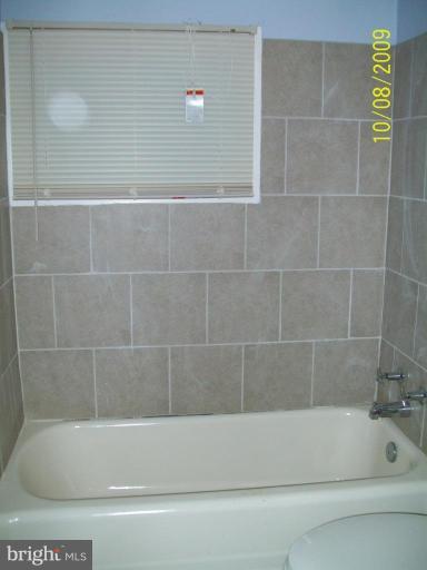 336 Suter Road Catonsville, MD 21228 - Photo 8 of 10 a bathroom with a bathtub