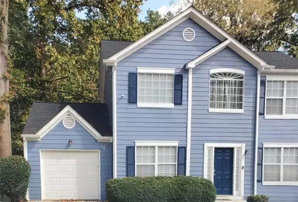 a front view of a house with yard