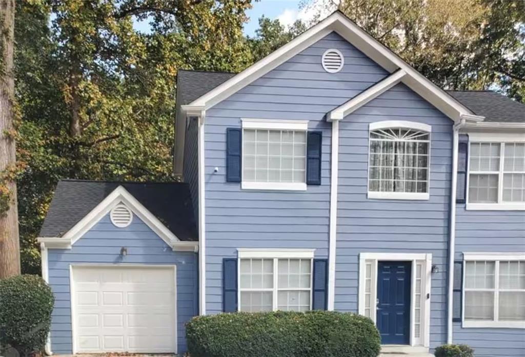 a front view of a house with yard