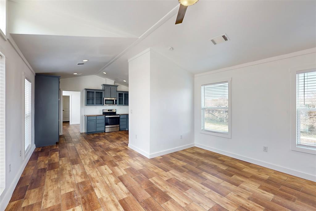 6715 Timberhaven Court Granbury, TX 76049 - Photo 11 of 40 a view of a kitchen with a sink and a window