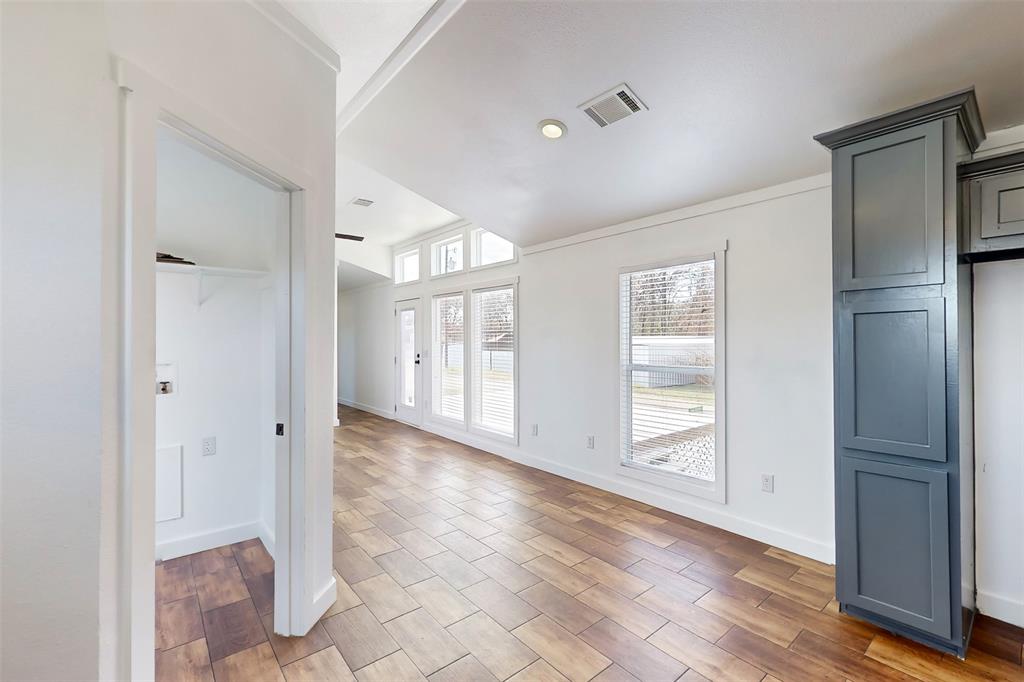 6715 Timberhaven Court Granbury, TX 76049 - Photo 17 of 40 a view of entryway with wooden floor