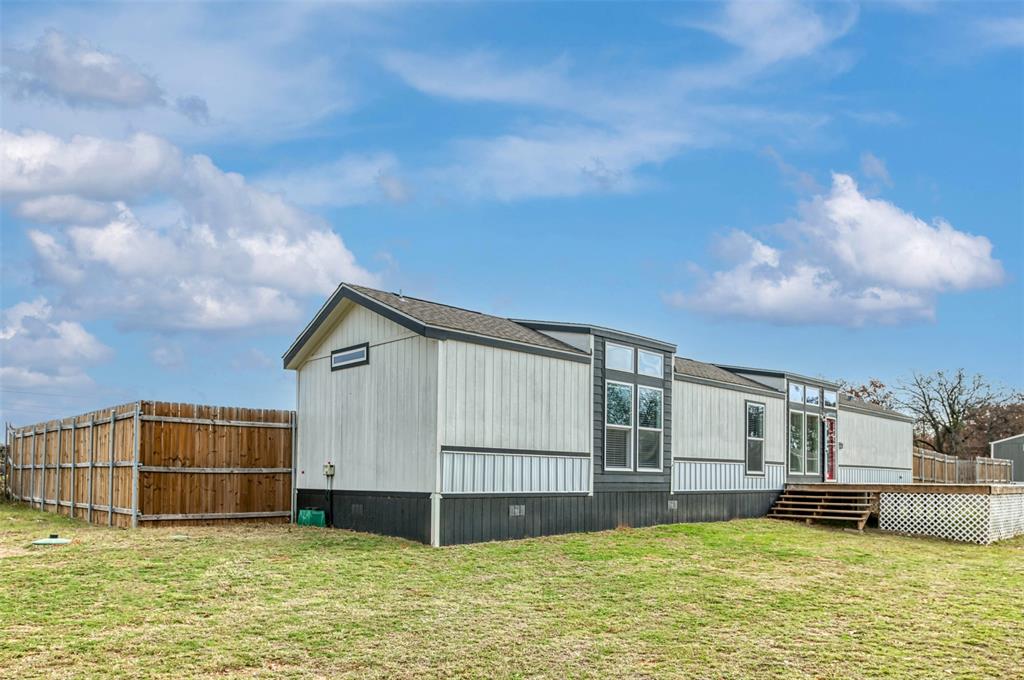 6715 Timberhaven Court Granbury, TX 76049 - Photo 2 of 40 a view of a house with swimming pool and sitting area