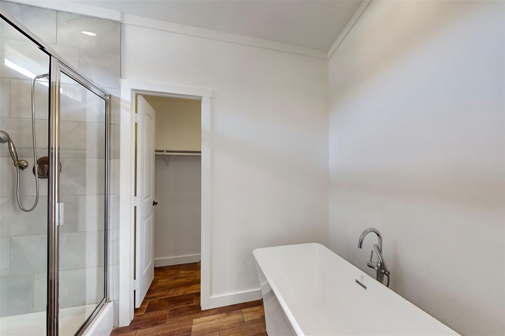 6715 Timberhaven Court Granbury, TX 76049 - Photo 21 of 40 a bathroom with a sink and mirror