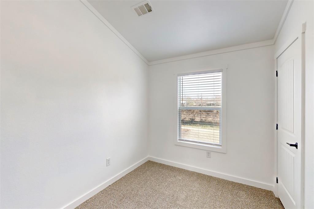 6715 Timberhaven Court Granbury, TX 76049 - Photo 28 of 40 an empty room with a window