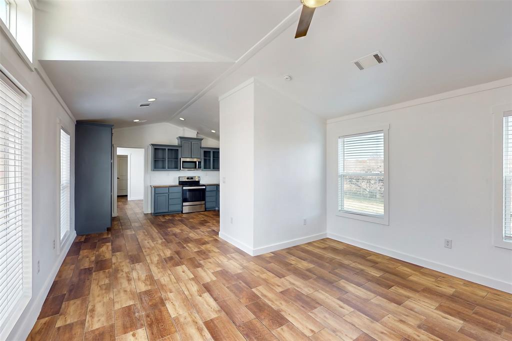 6715 Timberhaven Court Granbury, TX 76049 - Photo 34 of 40 a view of a kitchen with a stove