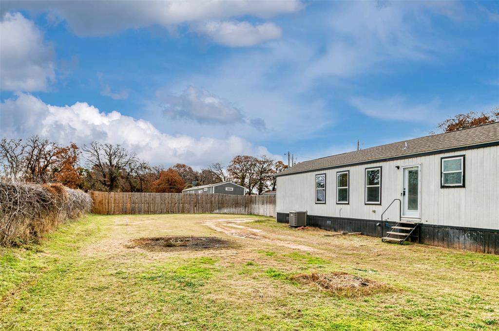 6715 Timberhaven Court Granbury, TX 76049 - Photo 37 of 40 a front view of a house with swimming pool
