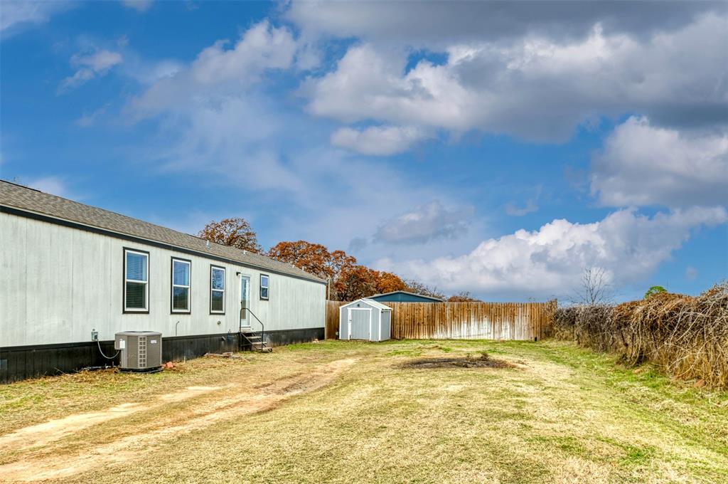 6715 Timberhaven Court Granbury, TX 76049 - Photo 39 of 40 a view of a house with a snow in the yard