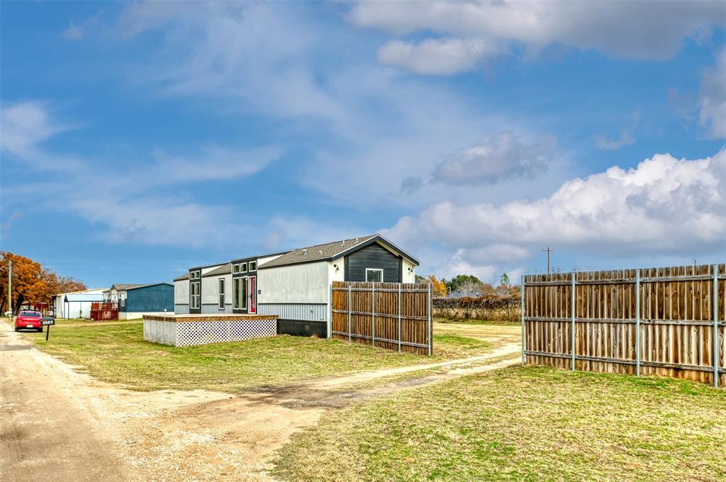 6715 Timberhaven Court Granbury, TX 76049 - Photo 4 of 40 a view of houses with outdoor space and swimming pool